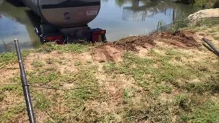 Semi Smashes Through Fence into Body of Water