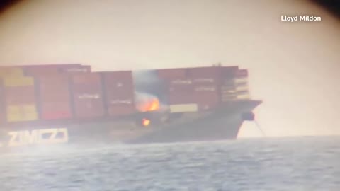 Reuters Fire blazes on cargo ship containers off Canada