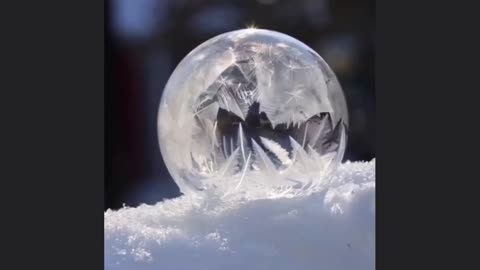 When exposed to freezing temperatures, the water in a soap bubble crystallizes