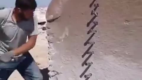 This man cuts a giant stone with amazing precission