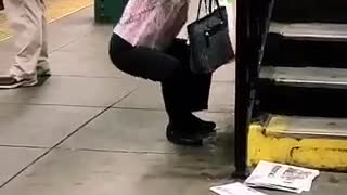 Old lady floral shirt doing squats on stair railing subway station