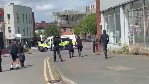 police Allow a group of Muslims to run past with weapons