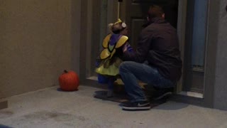 Young Girl Trick or Treating Takes a Tumble
