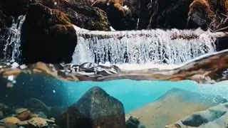 A relaxing view of the movement of river water with the sound of trickling water