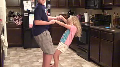 Big Brother Dances With His Little Sister On His Hoverboard