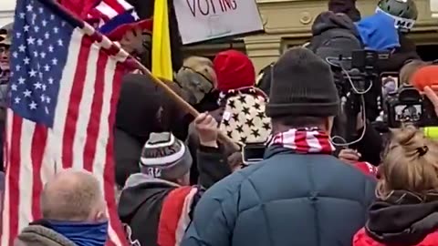 Patriots finding and stopping Antifa/Feds undercover trying to break the windows on January 6th.