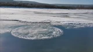 The ice disc spinning on the surface of the frozen Genhe River
