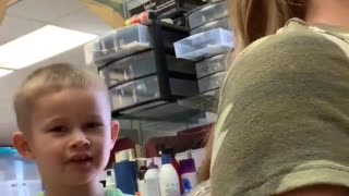 Comical 4 year old Hairdresser