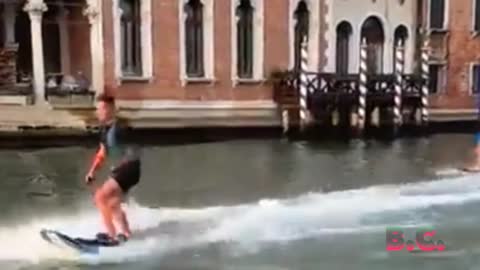 Venice mayor calls out 'imbeciles' surfing Italian city's historic canals