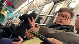 Two guys argue about barbecue sauce on a burger, in subway station
