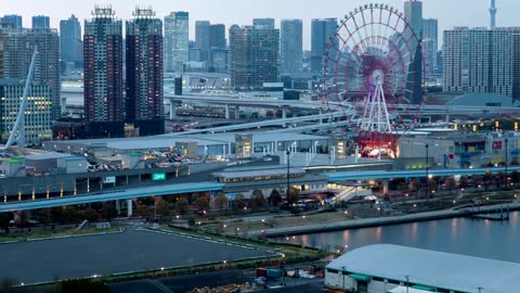 Great metropolis with a Ferris wheel as dusk