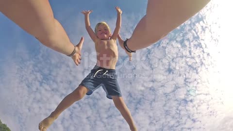 Happy father and son playing on tropical beach, carefree happy fun smiling lifestyle