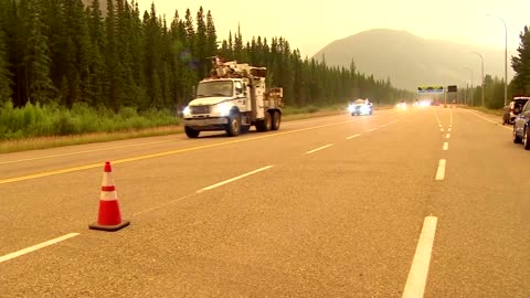 Alberta premier holds back tears as wildfire rages