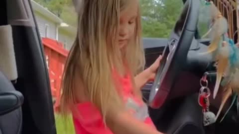little daughter try to car driving