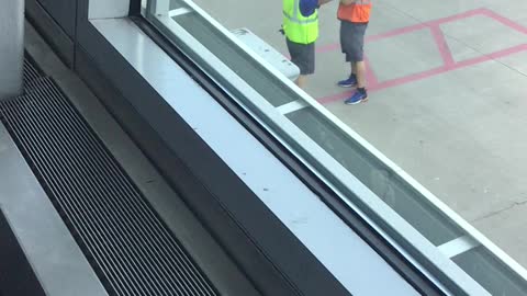 Ground crew at airport start fighting