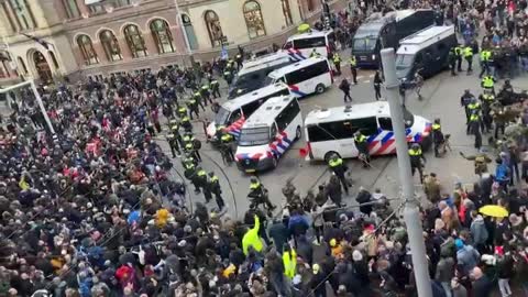 Amsterdam - More scenes from Amsterdam as protesters surround Police chanting for Freedom