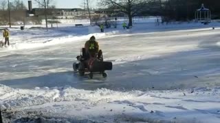 Guy films man using leaf blower on ice