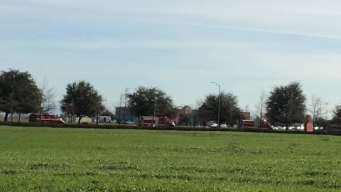 Firetrucks arriving at Ronald Mc Donald house, lead truck had Santa.