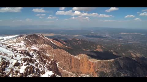 towering mountains with visible clouds