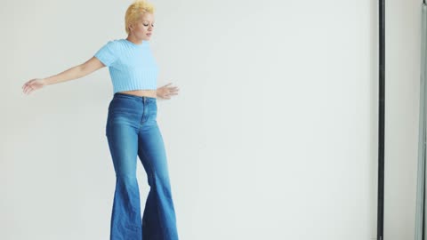 A Woman Turning Around thenLeaning on The Wall