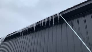 Clearing Ice Off Barn