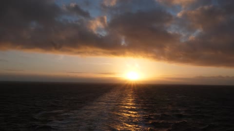 Sunset in the sea on a ship.