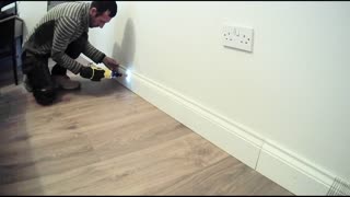 Stanley Fatmax in action, fitting skirting board