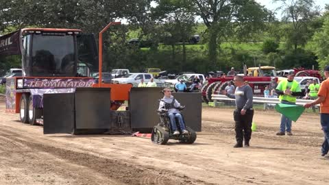 Disabled Kid Pulls Tractor in Wheelchair