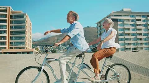 Happy senior couple enjoying on tandem bicycle 🚲🥰❤️