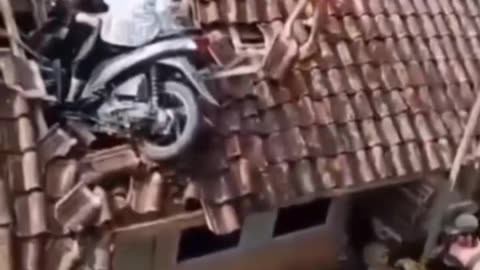 It's a rare incident... how come a motorbike can climb onto the roof of a house