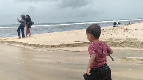 the joy of a child playing on the beach