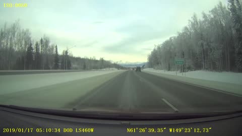 Truck Slides into Snow Filled Median Strip