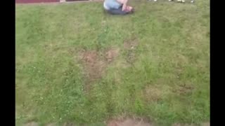 Drunk man rolls down a hill