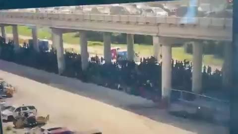 FLASHBACK: Drone footage shows a large caravan of migrants being held by Border Patrol agents in August