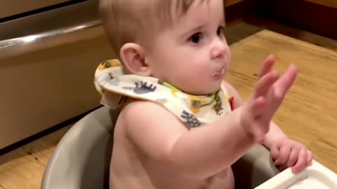 The baby is drooling when he sees the food and his hands are still catching the food, so cute!