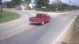 Motorcyclist Almost Crushed by Overloaded Pickup