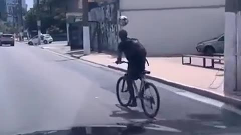 October 8, 2023A young boy in Brazil practicing heading a ball while riding his bicycle🚴⚽