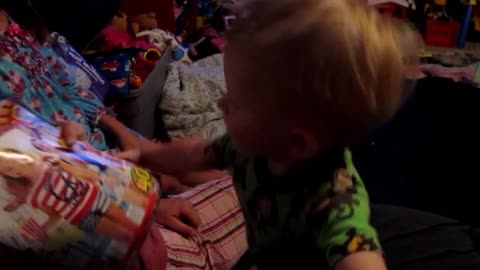 Cute Tot Steals His Sister's Magazine