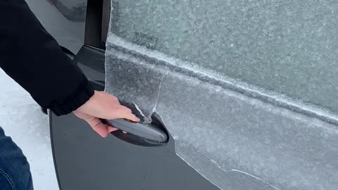 Opening the Door on an Ice-Covered Car