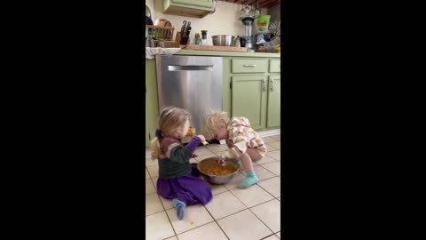 Loving siblings share tasty treat together