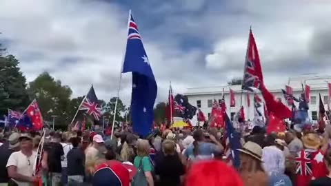 Crowd sings the Australian Anthem At Canberra Parliament House Australia stopping Draconian Rule