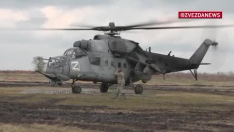 Footage of a Russian Air Force Mi-35 helicopter striking enemy positions