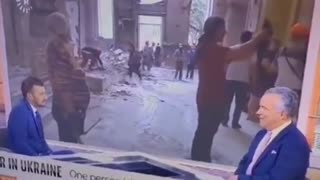 Ukraine war footage. Woman picks up fake concrete.