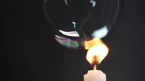 Popping Bubbles with a Candle