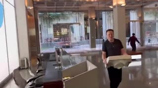 Elon Musk Walks Into Twitter Holding A Sink