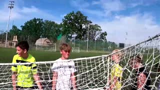 Ukrainian kids play soccer in bombed-out stadium