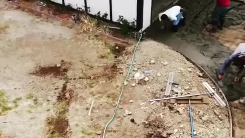Aerial view of Pouring Concrete on the Driveway