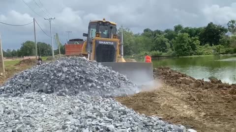 New bulldozer spreading gravel processing features building road foundation-13