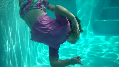 Two and a half year old twirling underwater! So carefree!