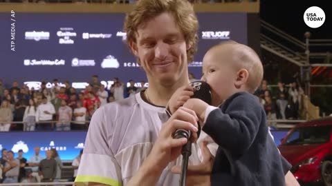 Cute baby steals the mic during Chile Open champion's interview